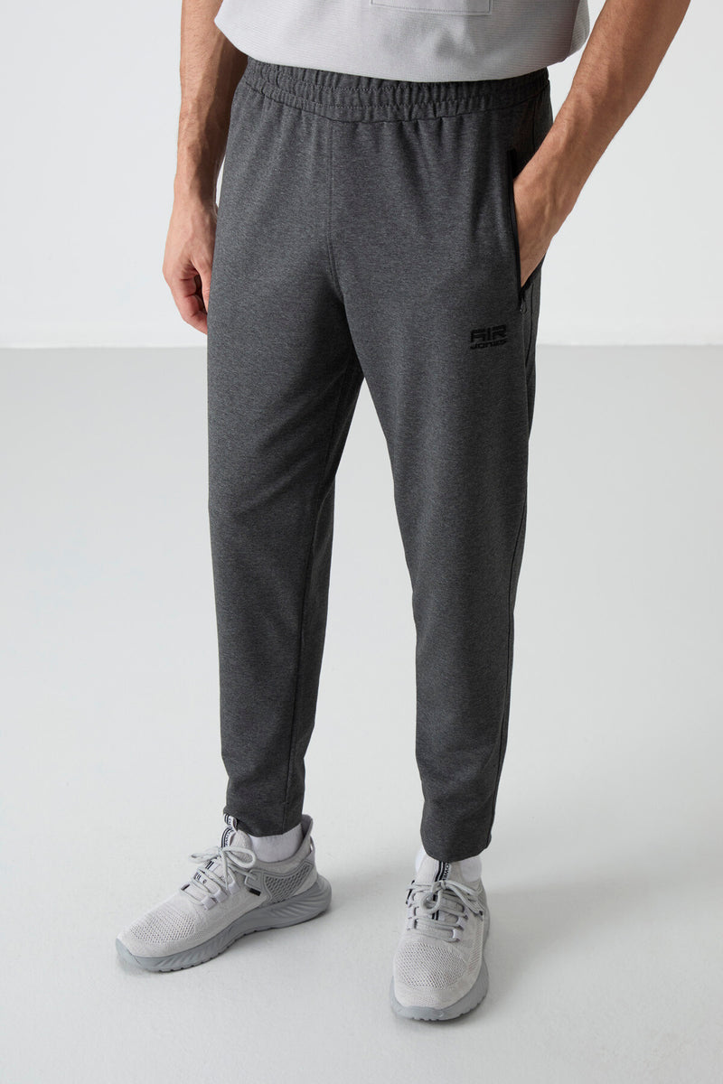 Jogging homme avec taille élastique et fermetures éclair